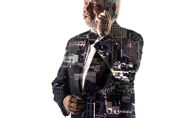 Image showing Portrait of bearded businessman smiling. Double exposure city on the background.