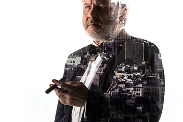 Image showing Portrait of bearded businessman. Double exposure city on the background.