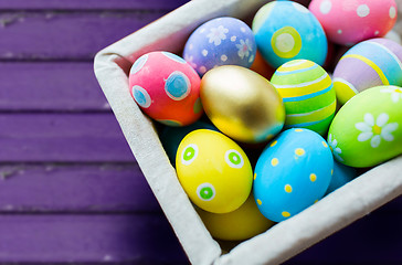 Image showing close up of colored easter eggs in basket