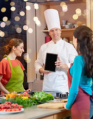 Image showing happy women with chef and tablet pc in kitchen