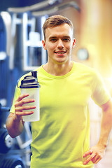 Image showing smiling man with protein shake bottle