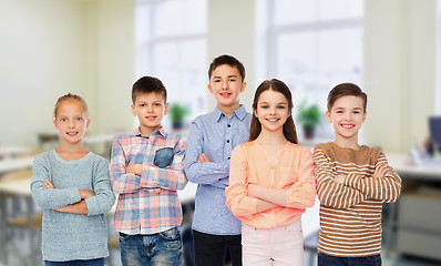 Image showing happy students at school over classroom background