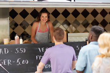 Image showing queue of customers and saleswoman at food truck