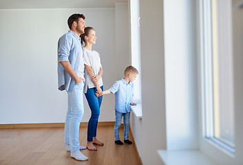 Image showing happy family with child at new home or apartment