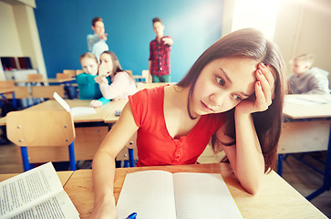 Image showing students gossiping behind classmate back at school