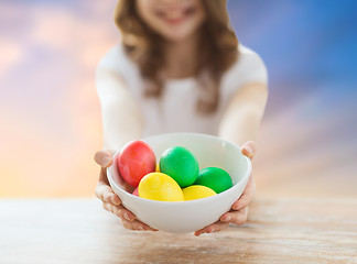 Image showing close up of girl holding colored easter eggs