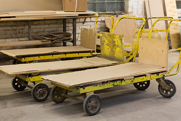 Image showing old loaders at furniture factory workshop