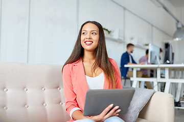 Image showing happy asian woman with tablet pc working at office