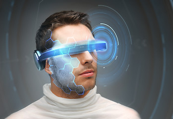 Image showing man in 3d glasses with virtual hologram