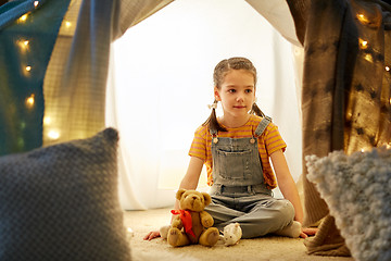 Image showing little girl with toys in kids tent at home