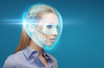 Image showing woman in virtual helmet and goggles over blue