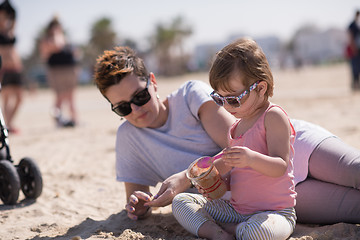 Image showing Mom and daughter on the beach