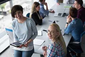 Image showing Pretty Businesswomen Using Tablet In Office Building during conf