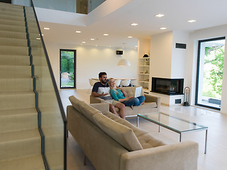 Image showing young happy couple relaxes in the living room