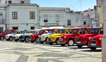 Image showing Old and colored cars.