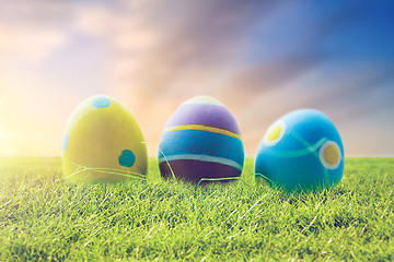 Image showing close up of colored easter eggs on grass