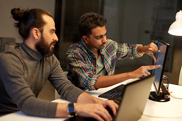 Image showing creative team with computer working late at office