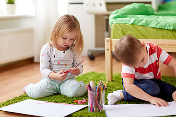 Image showing happy kids drawing at home