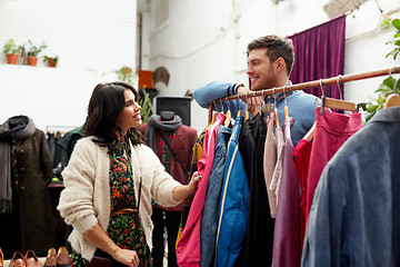 Image showing happy couple at vintage clothing store hanger