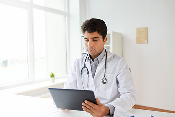 Image showing doctor with tablet pc and stethoscope at clinic