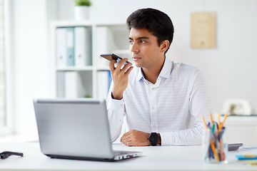 Image showing businessman using voice recorder on smartphone