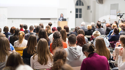 Image showing Woman giving presentation in lecture hall at university.