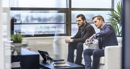 Image showing Business people sitting at working meeting in modern corporate office.