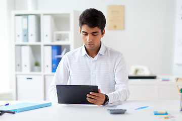 Image showing businessman working with tablet pc at office