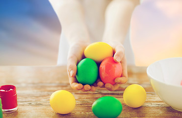 Image showing close up of girl holding colored easter eggs