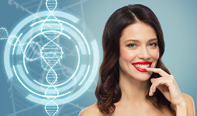 Image showing woman with red lipstick over dna molecule
