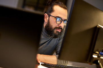 Image showing close up of creative man working at night office