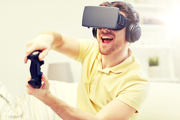 Image showing man in virtual reality headset with controller