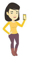 Image showing Woman holding ringing mobile phone.