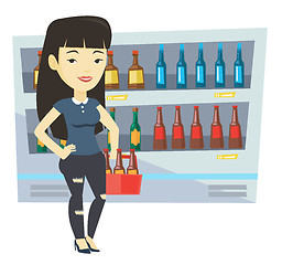 Image showing Woman with pack of beer at supermarket.