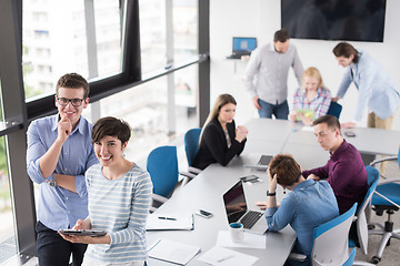 Image showing Two Business People Working With Tablet in office