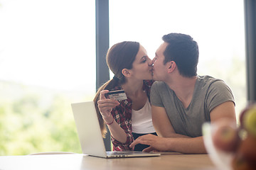 Image showing happy young couple buying online