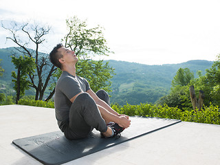 Image showing man doing morning yoga exercises