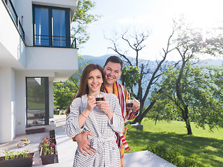 Image showing Young beautiful couple in bathrobes