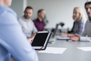 Image showing Businessman using tablet in modern office