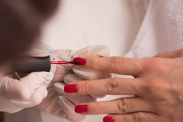 Image showing Woman hands receiving a manicure