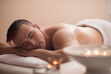 Image showing handsome man resting in a spa massage center