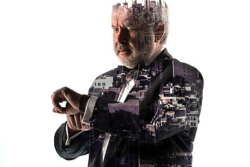 Image showing Portrait of bearded businessman. Double exposure city on the background.