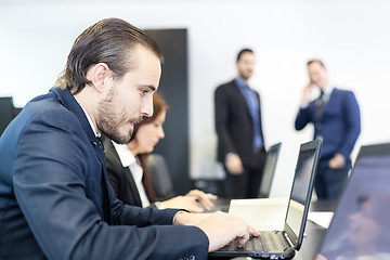 Image showing Business people in modern corporate office.