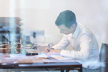 Image showing Businessman working with documents in the office