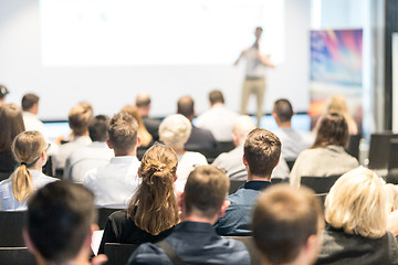 Image showing Business speaker giving a talk at business conference event.