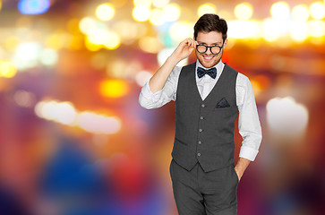 Image showing man in suit with glasses over night city lights