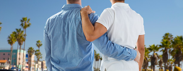 Image showing close up of gay couple hugging over los angeles