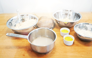 Image showing bowls with flour and egg whites at bakery kitchen