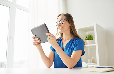 Image showing woman with tablet pc working at home or office