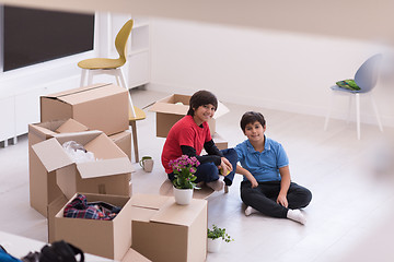 Image showing boys with cardboard boxes around them